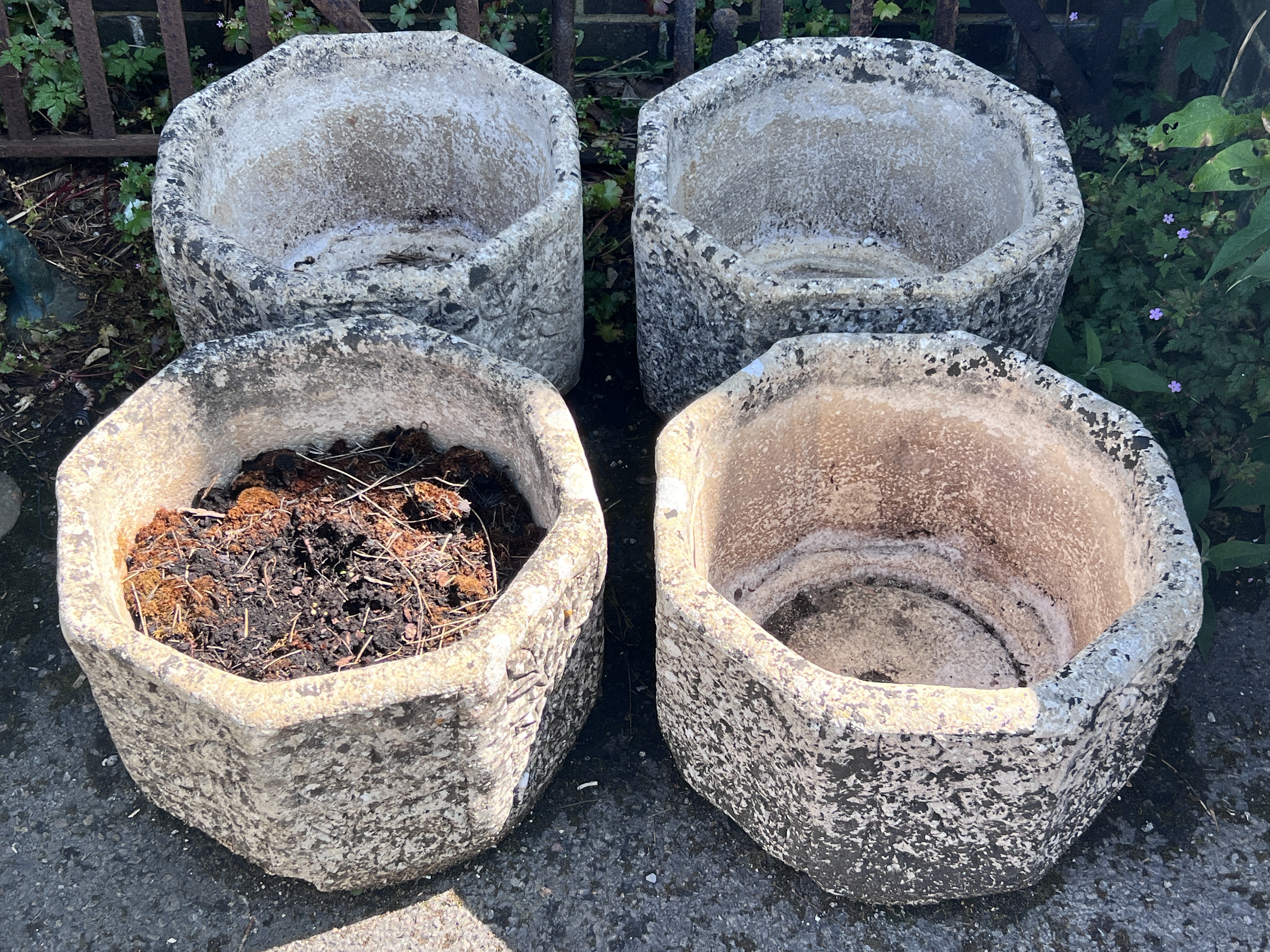 A set of four reconstituted stone hexagonal garden planters, width 40cm, height 29cm